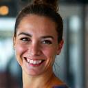 Happy client Jessica M. smiling at the gym.